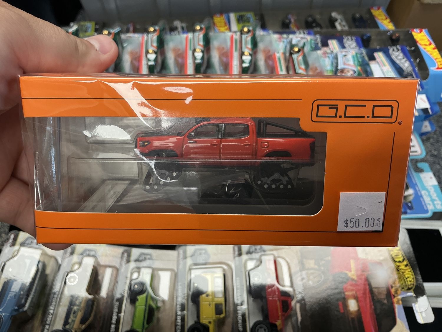 Toyota Tacoma w/ snow tracks red
