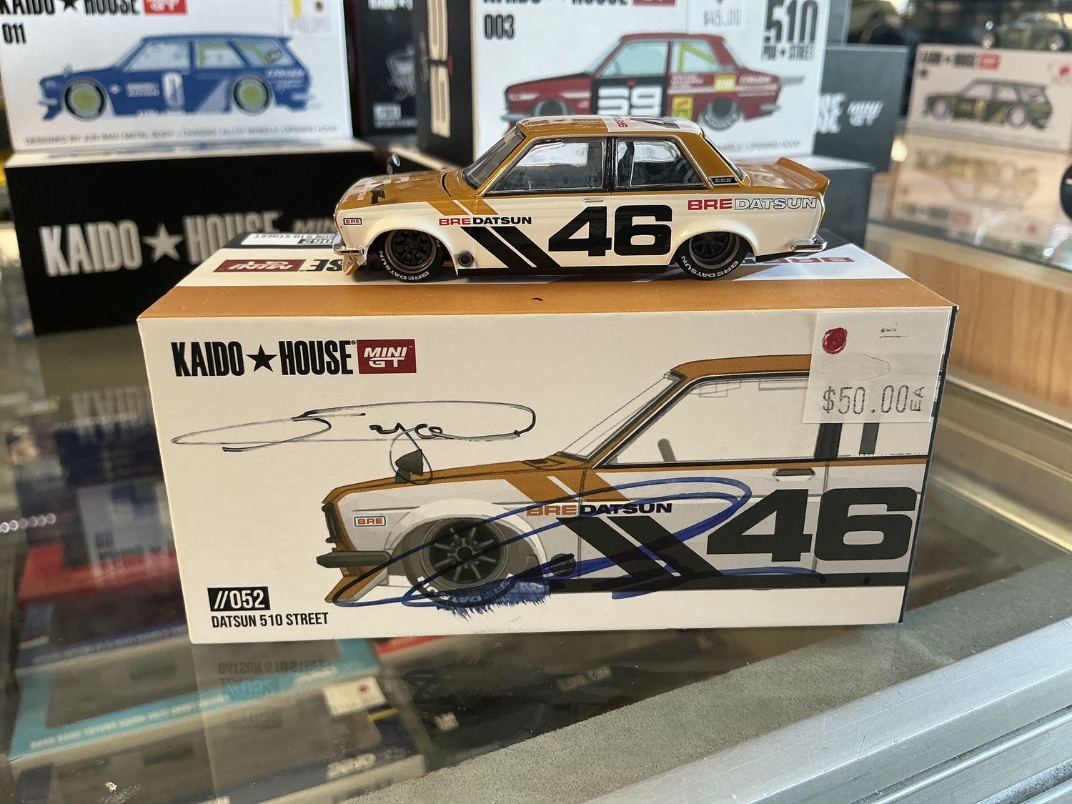 Datsun 510 street yellow signed