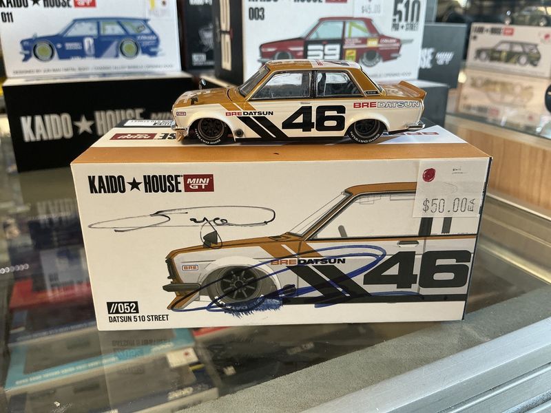 Datsun 510 street yellow signed