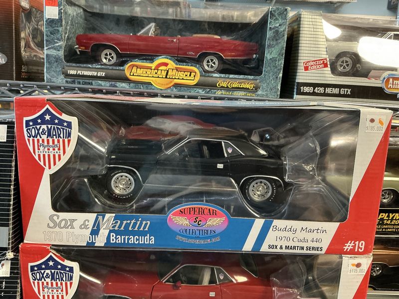 Socks and Martin 1970 Plymouth barracuda black Buddy Martin