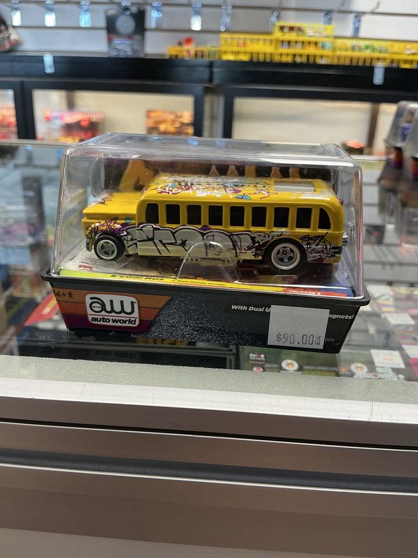 S’cool bus yellow graffiti