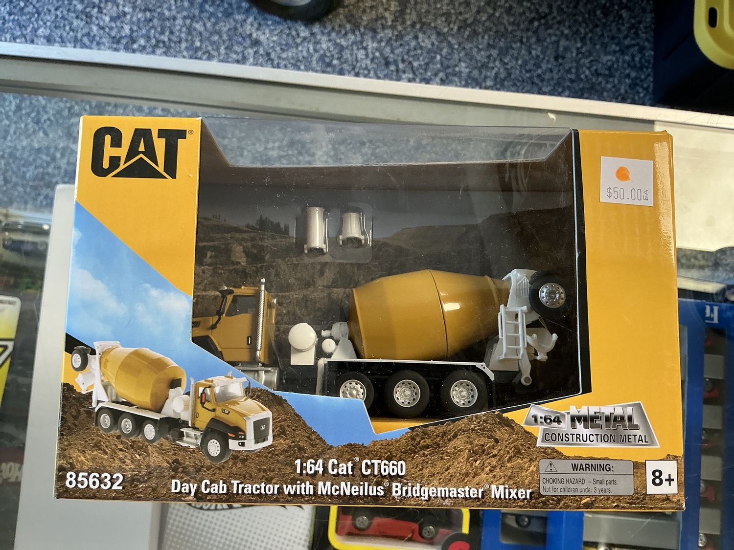 Cat CT 660 day cab tractor with McNeilus Bridgemaster mixer