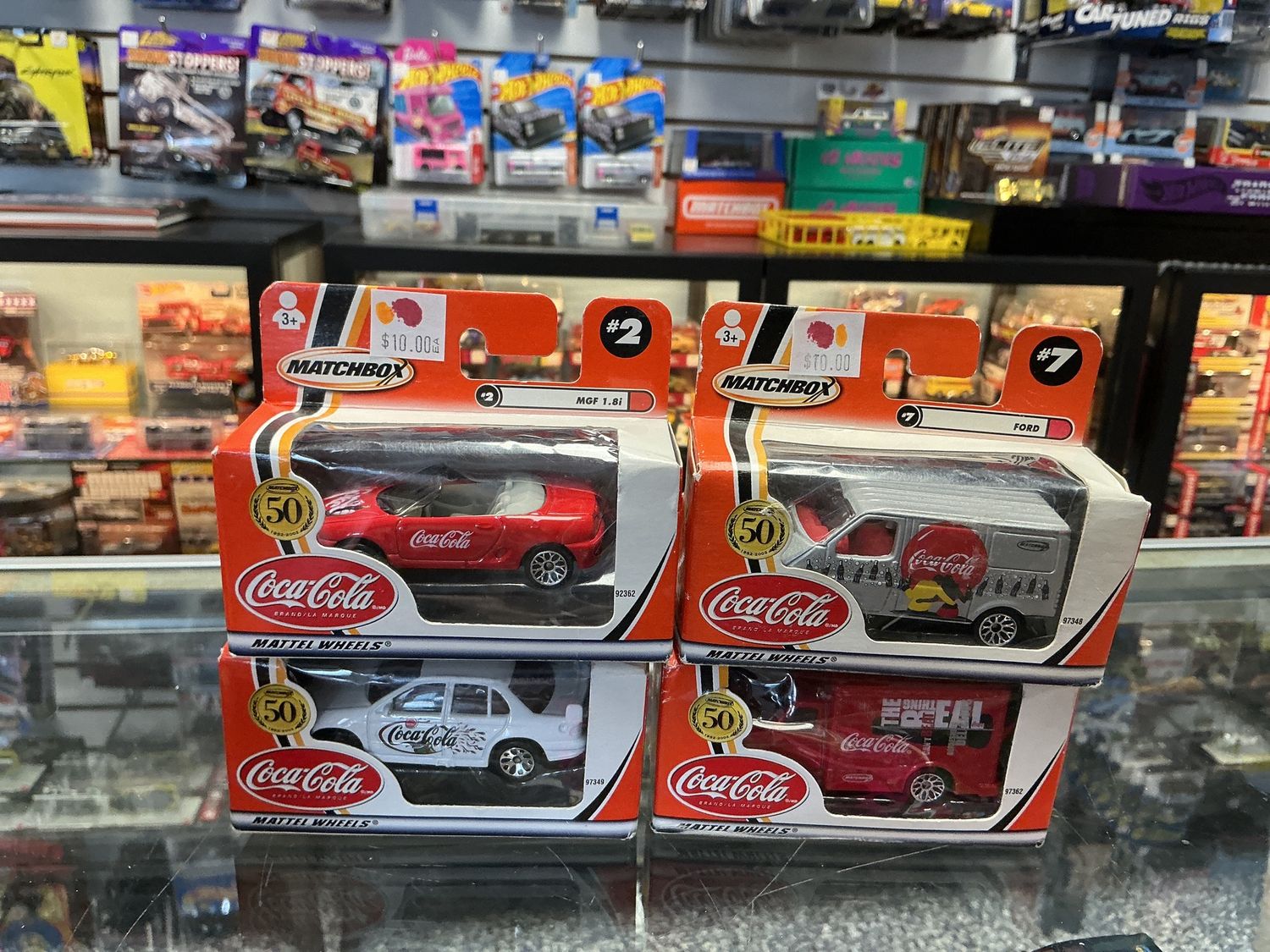 Assorted boxed coke cars