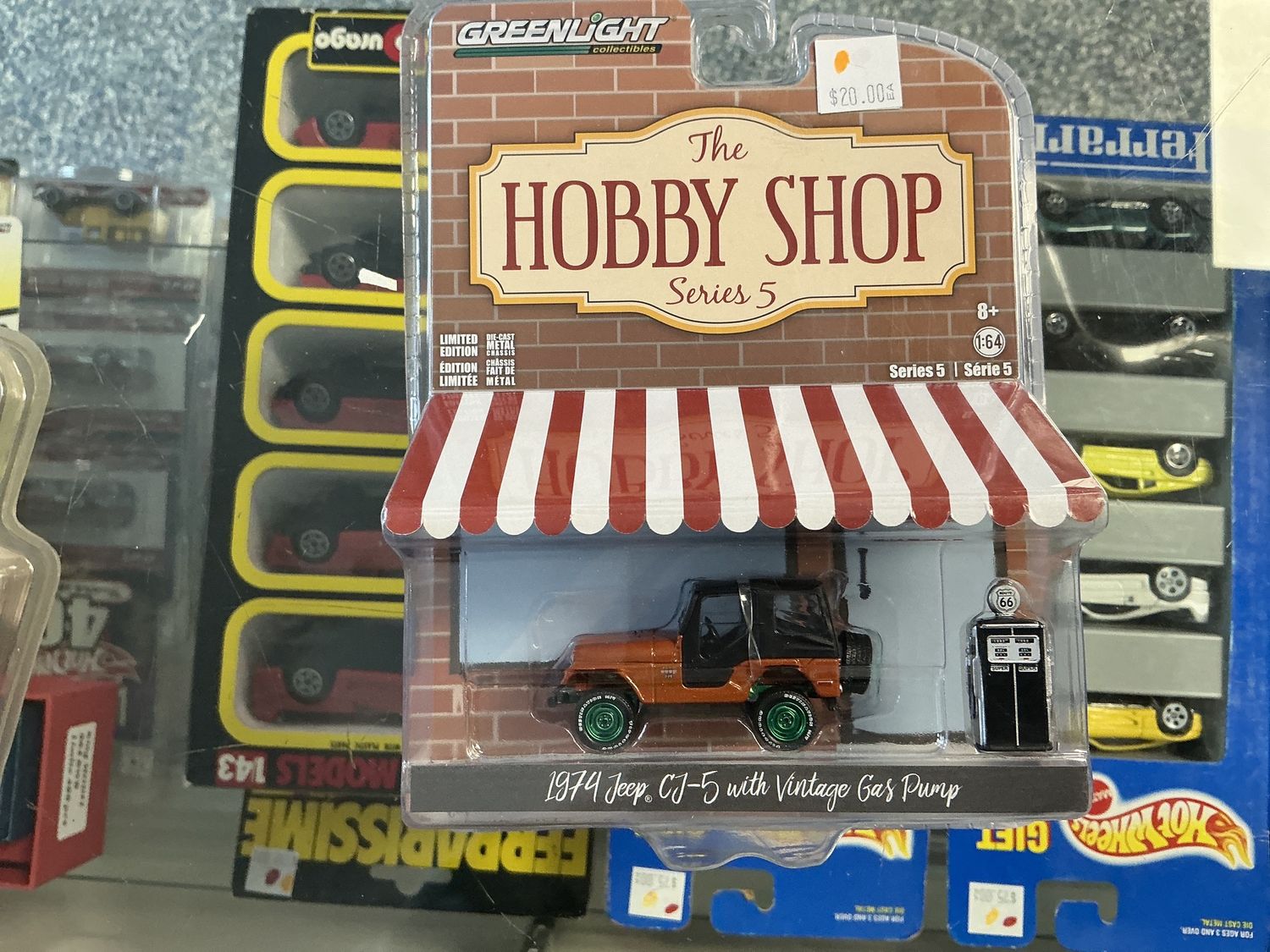 1974 Jeep CJ five with vintage gas pump Greenie