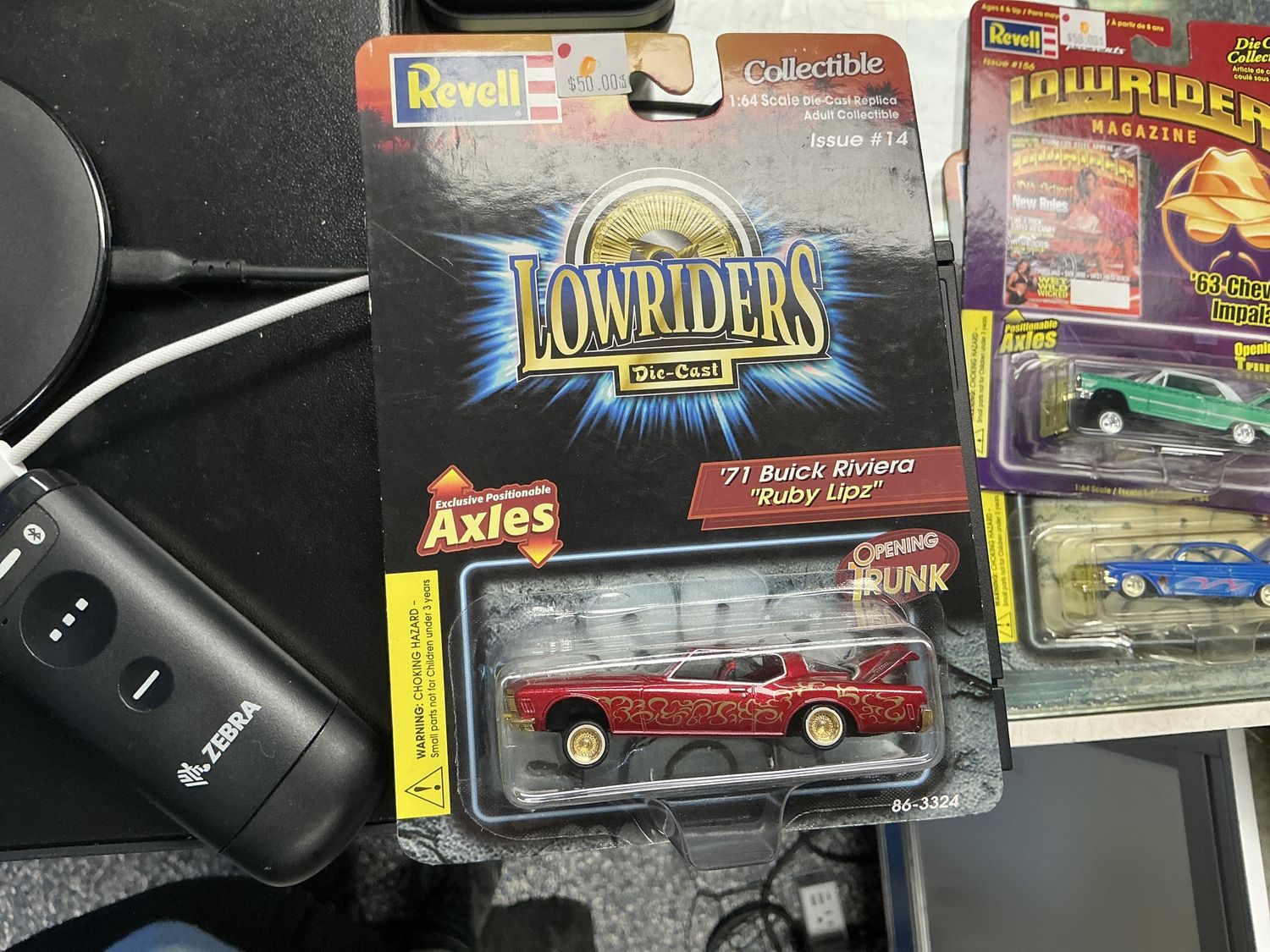 A writer in 1971 Buick Riviera, ruby lipz