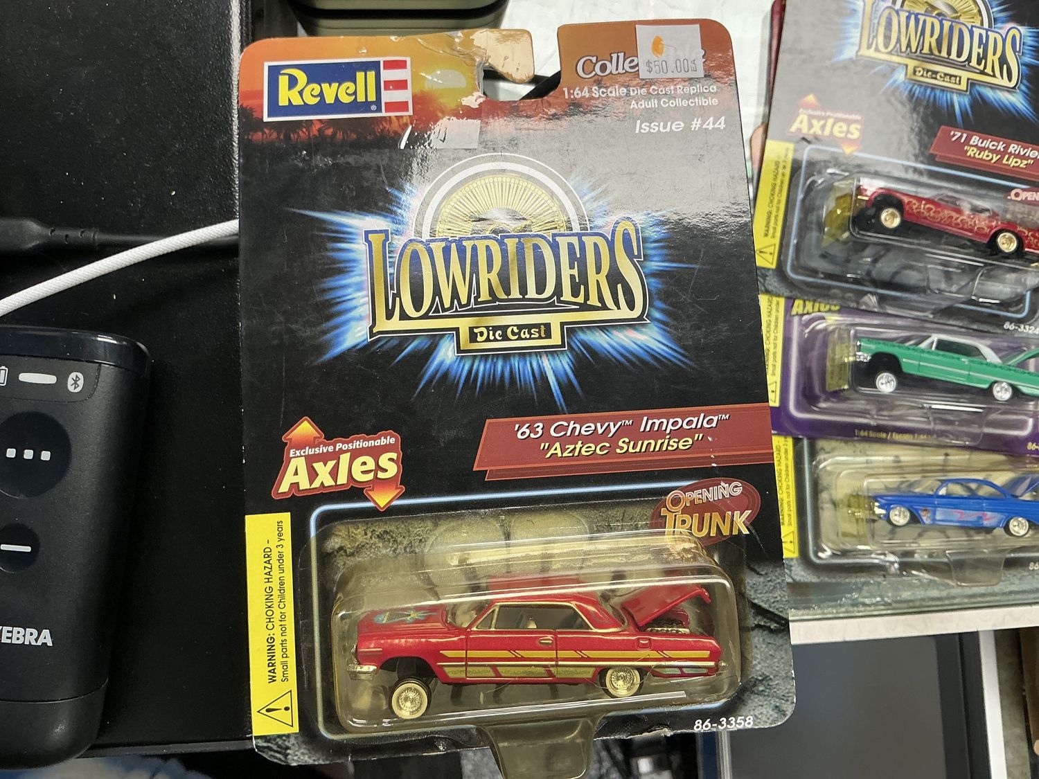 Lowrider 1963 Chevy Impala Aztec sunrise red