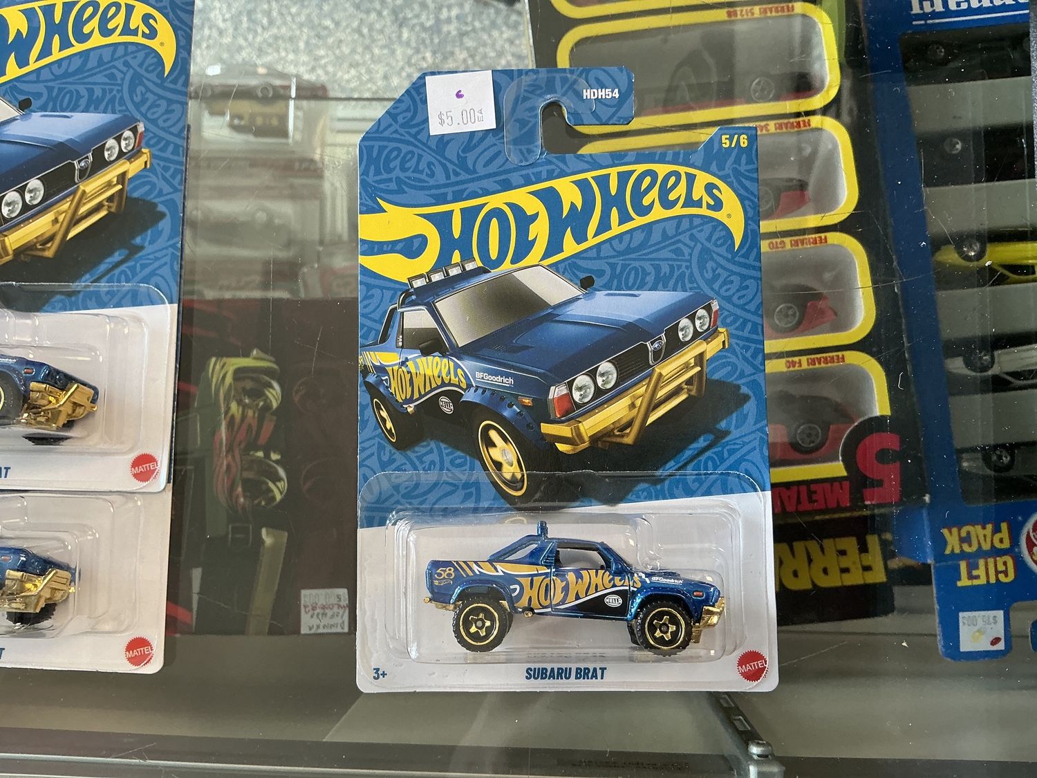 58th anniversary, hot wheels, blue and gold Subaru brat