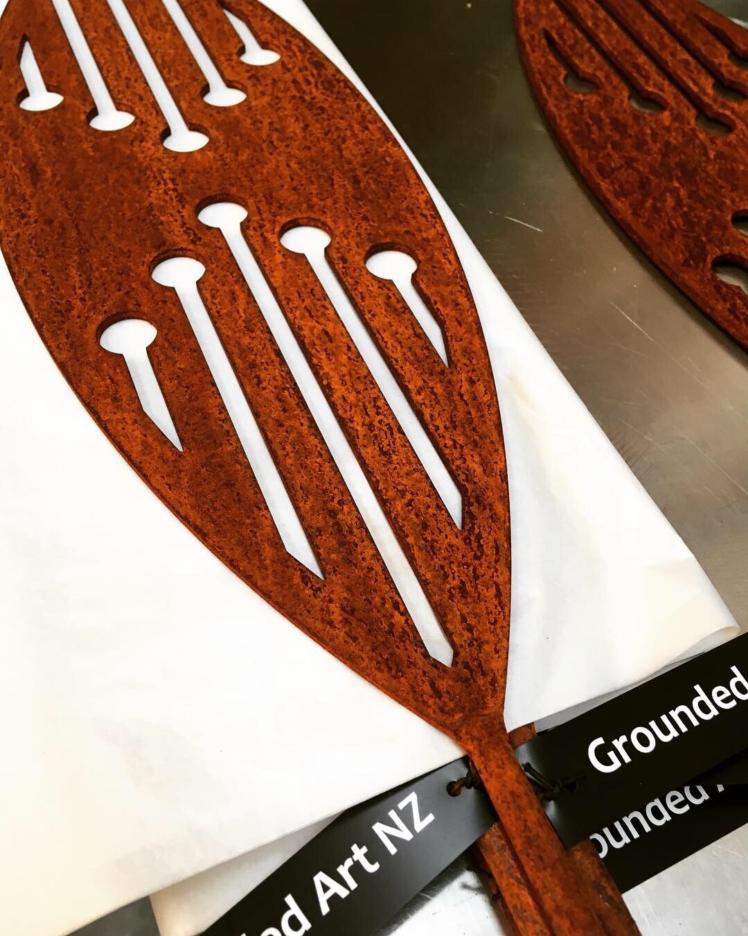 Grounded Art NZ rusty Corten garden spear with white background. Proudly made in South Otago, New Zealand by Brendon &amp; Jane.