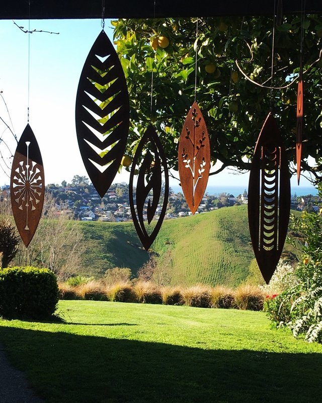 Corten Spinning Art by Grounded Art NZ suspended outdoor garden art in various designs. Corten will rust with a warm patina. 