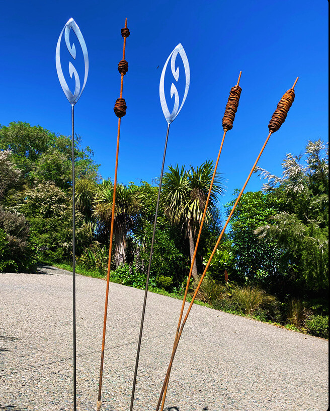 mini fish hook spears grouped with rusty seedpods and bulrushes by Grounded Art NZ
