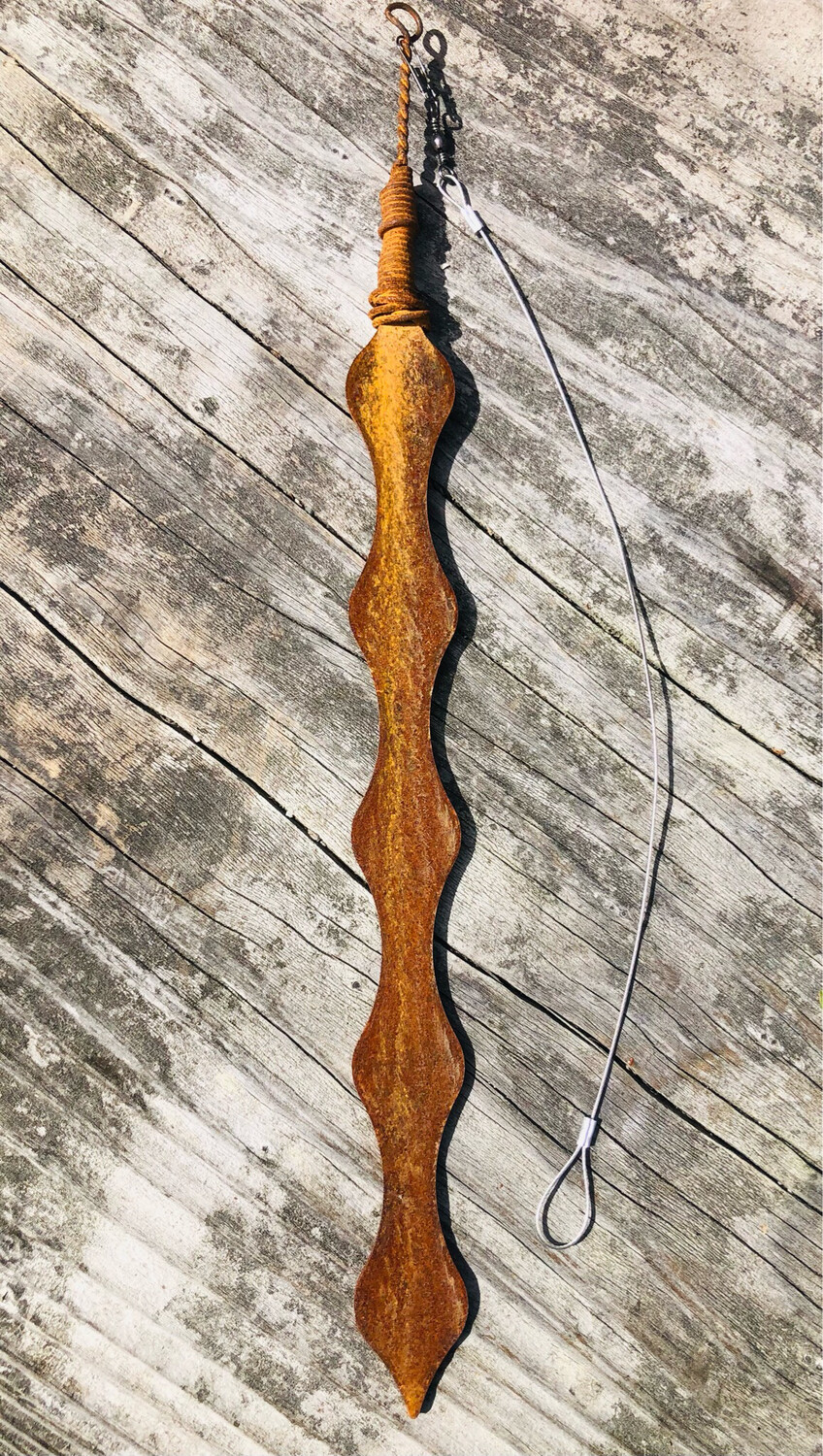 Rusty Corten Kowhai pod by Grounded Art NZ on a timber background. Warm patina contrasts against the natural wood.