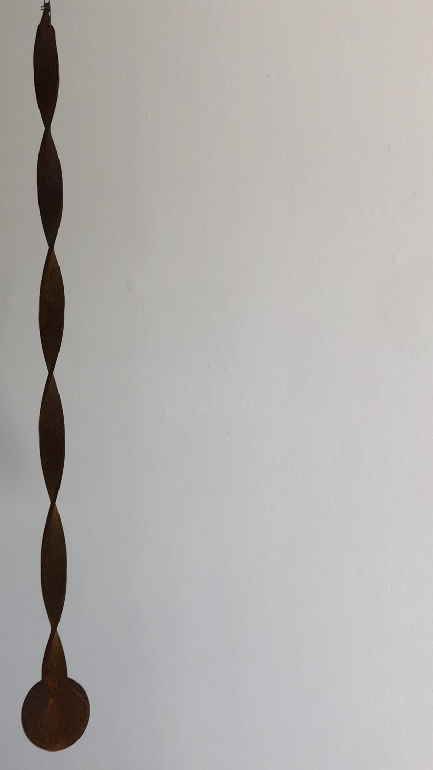 Corten Miro by Grounded Art NZ of Otago. Small metal garden art with a twisted Corten design that spins, twirls and twists.