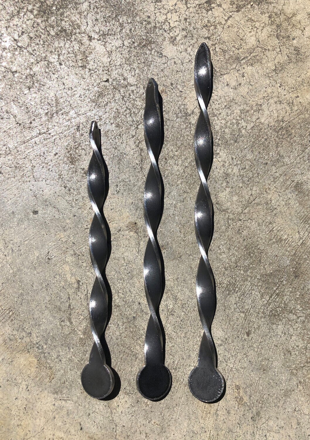 3 sizes of Corten Miro by Grounded Art NZ of South Otago, NZ. The natural colour of the Corten will weather to a rusty hue.
