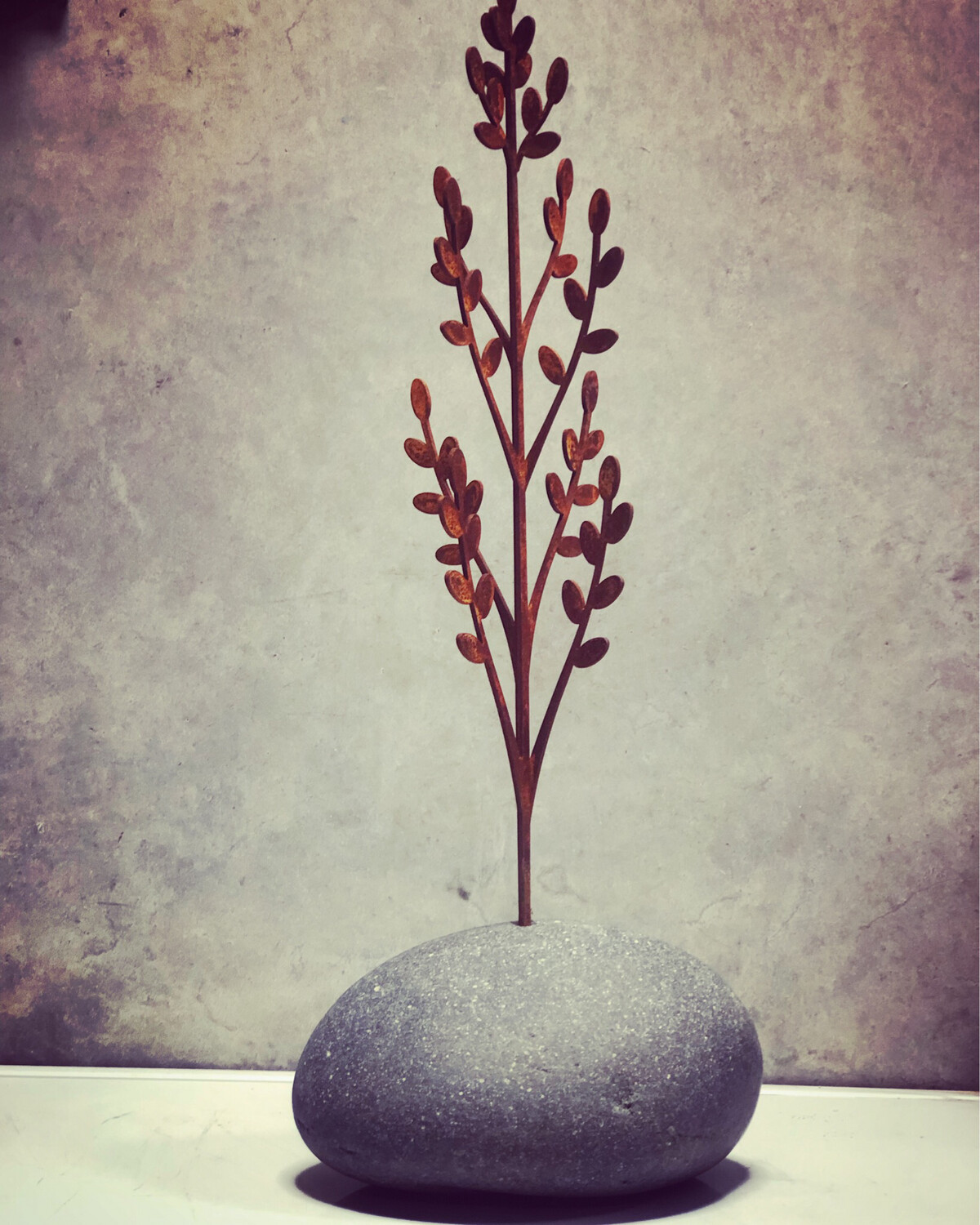 Toitiiti Botanical Sculpture by Grounded Art NZ. Corten steel garden art. Beautiful delicate design in a natural stone base. 