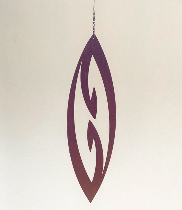 Corten Garden Art by Grounded Art NZ. Fish Hook (mini) Spinning Art hanging in front of a lighter coloured background. 