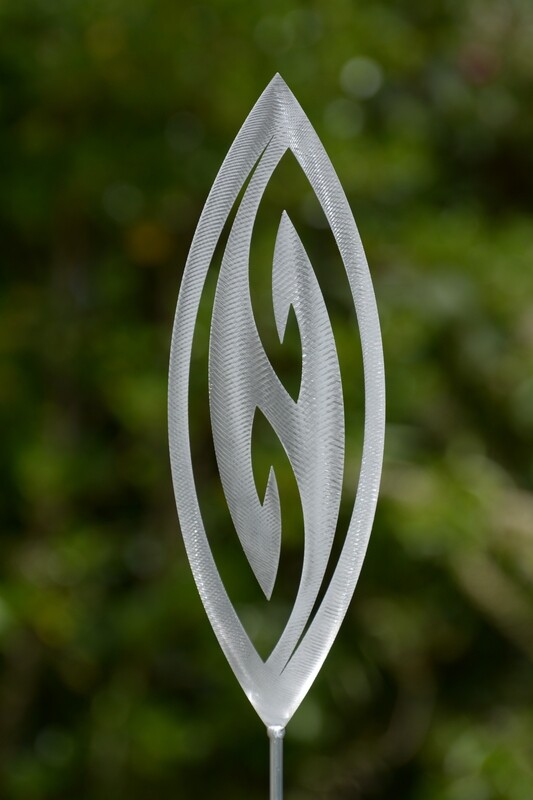Fish Hook Aluminium Garden Art Spear by Grounded Art NZ in an established lush green native NZ garden. 
