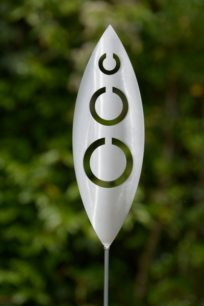 Tribal Aluminium Garden Art Spear by Grounded Art NZ in an established lush green native NZ garden.