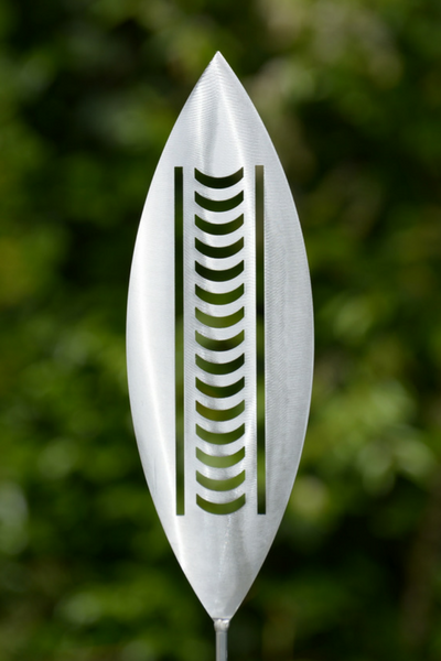 Nikau Aluminium Garden Art Spear by Grounded Art NZ in an established lush green native NZ garden. South Otago, New Zealand.