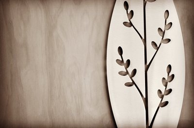 detail of the Korokio Aluminium Spear design by Grounded Art NZ in a gallery with the pale plywood wall behind.