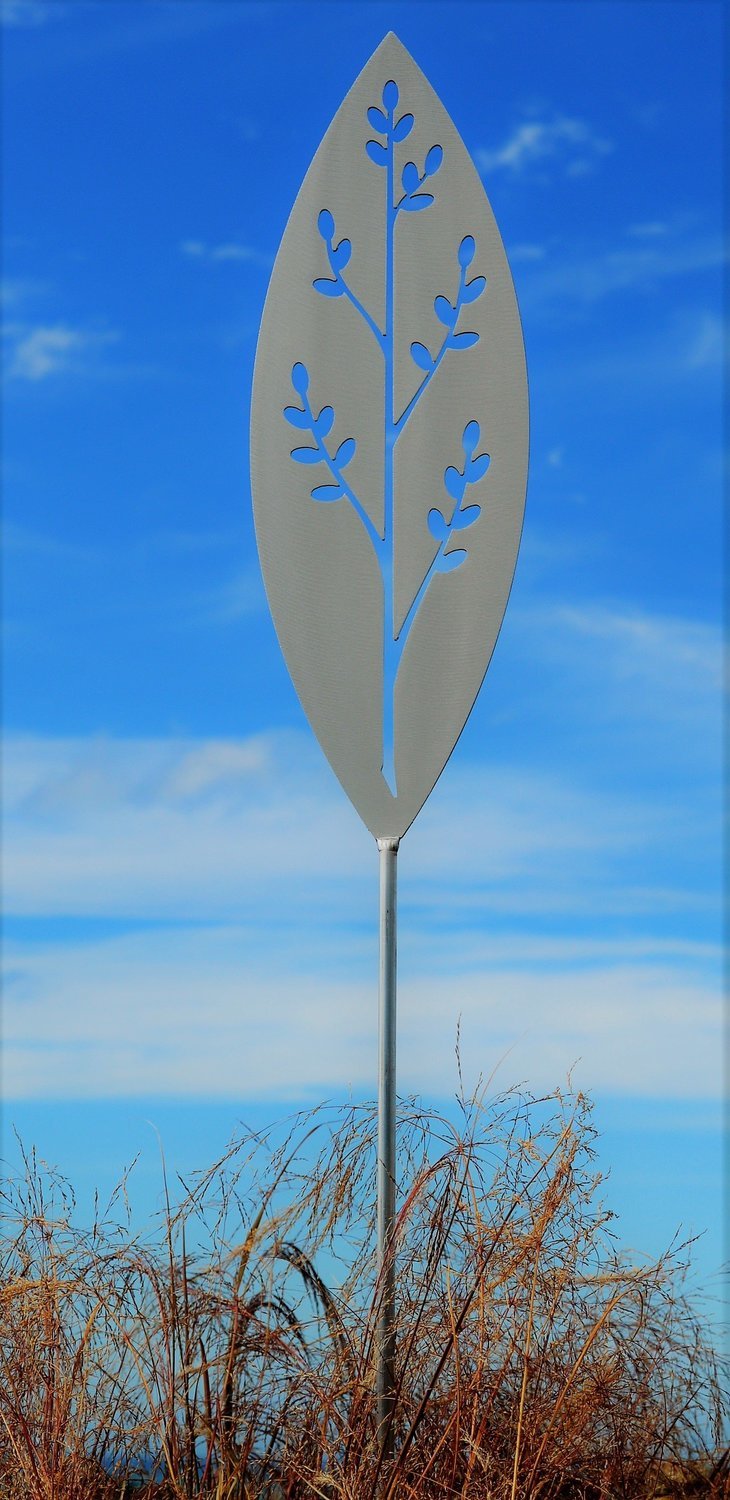 Korokio Aluminium Spear by Grounded Art NZ with a blue sky behind. Metal Garden Art with shine and sheen.