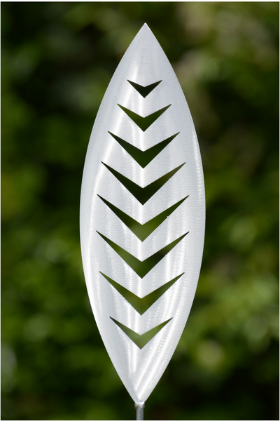 Arrow Aluminium Spear by Grounded Art NZ in an established lush green native NZ garden. 