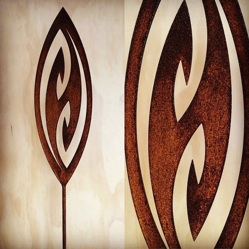 Corten garden spear in Fish Hook design by Grounded Art NZ in a gallery setting