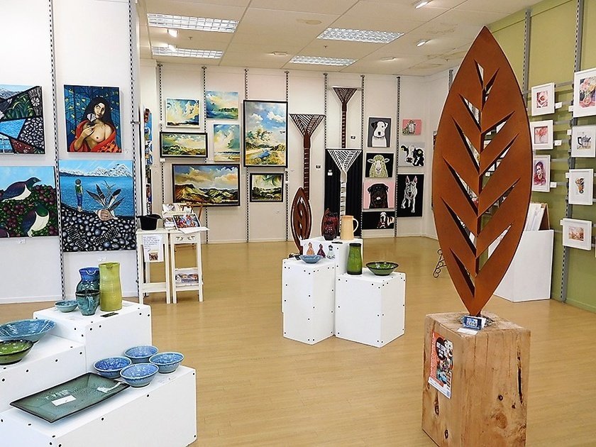 Arty Nelson Gallery with a large 3D Corten leaf sculpture in the foreground and other Grounded Art NZ sculptures behind.
