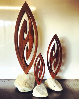 Trio of rusty 3D Corten Fish Hooks in natural stone bases made by Grounded Art NZ. Natural NZ made Metal garden art.