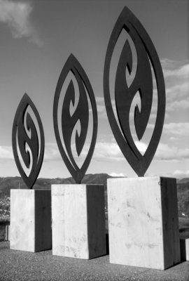 3 Corten Fish Hook Sculptures by Grounded Art NZ in wooden bases. Turn you garden into a gallery with our NZ made garden art.