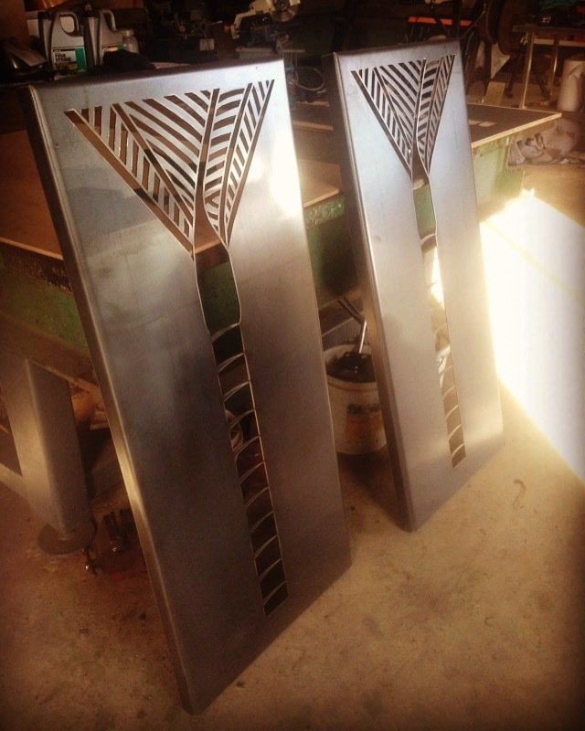 Corten Nikau Panels in their natural raw metal state, before any rusting has begun. Grounded Art NZ wall panels made in Otago