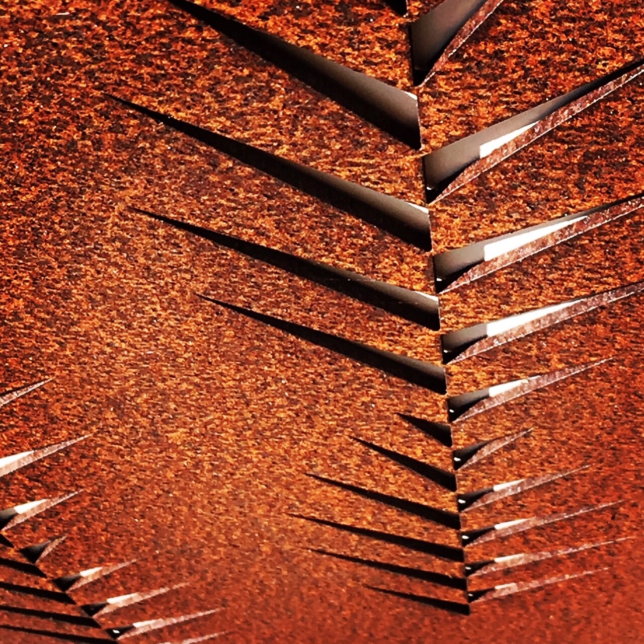 Close up of the Leaf pattern detail in a Grounded Art NZ Leaf screen made of New Zealand Corten Steel as viewed from above.