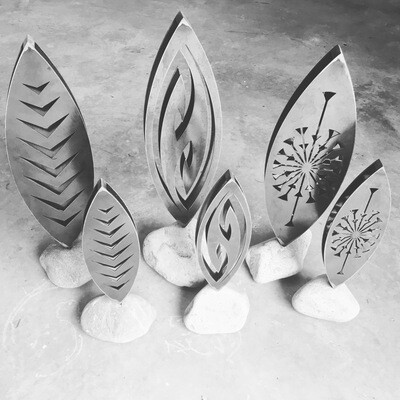 3D Corten sculptures by Grounded Art NZ all in natural stone bases and in clean Corten steel prior to rust process beginning