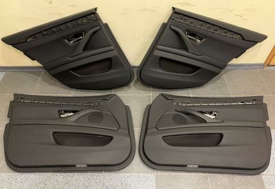Комплект обивки передней и задней двери BMW 5 F11, черная полукожаная, с подсветкой