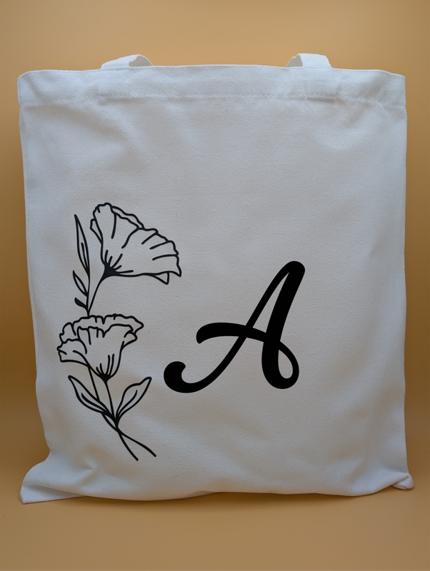 Personalisierte Stofftasche mit floralem Design und Anfangsbuchstaben