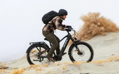 A man riding a Heybike Alpha Ebike in Black
