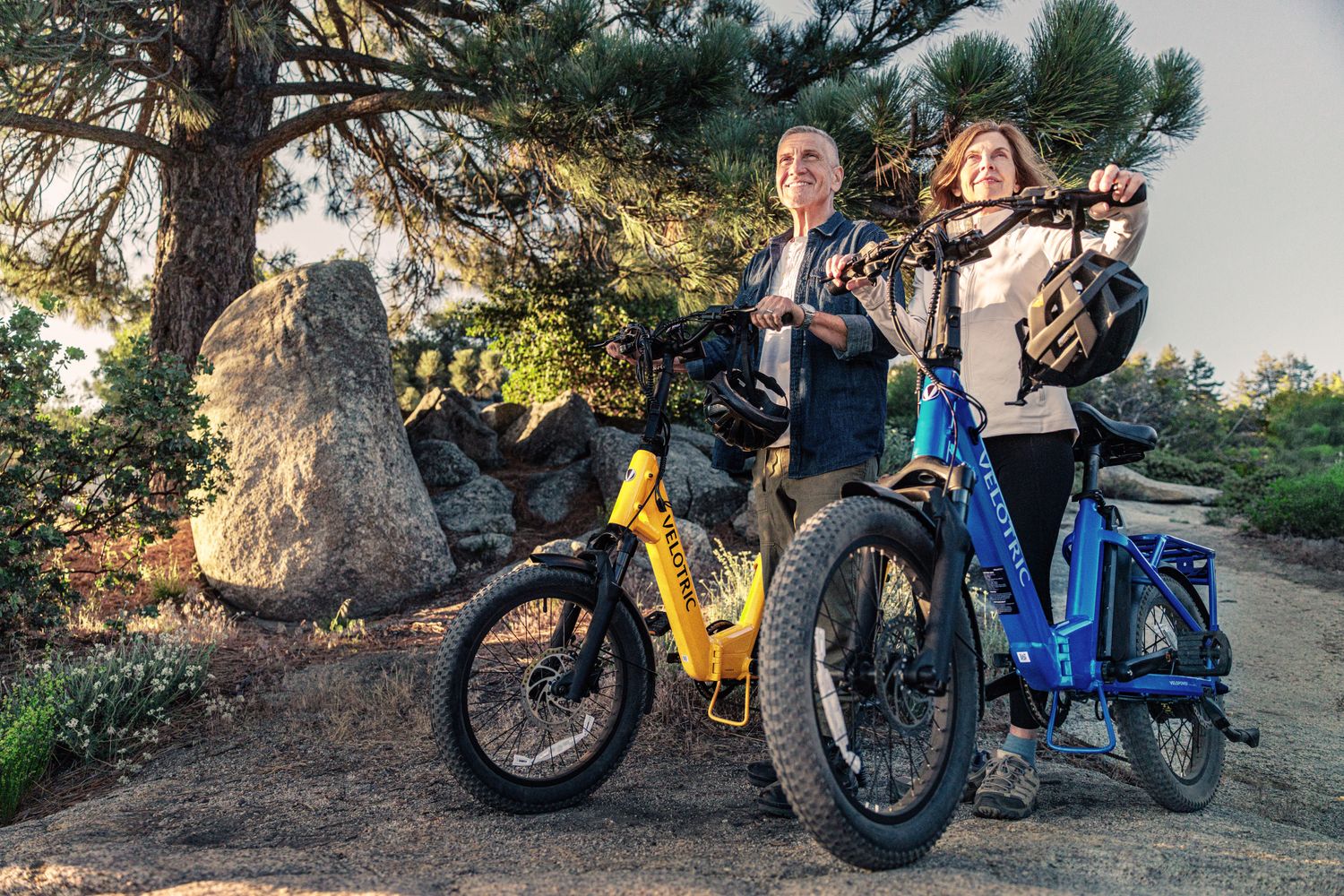 Two people with their Two Velotric Fold 1 Plus Ebikes