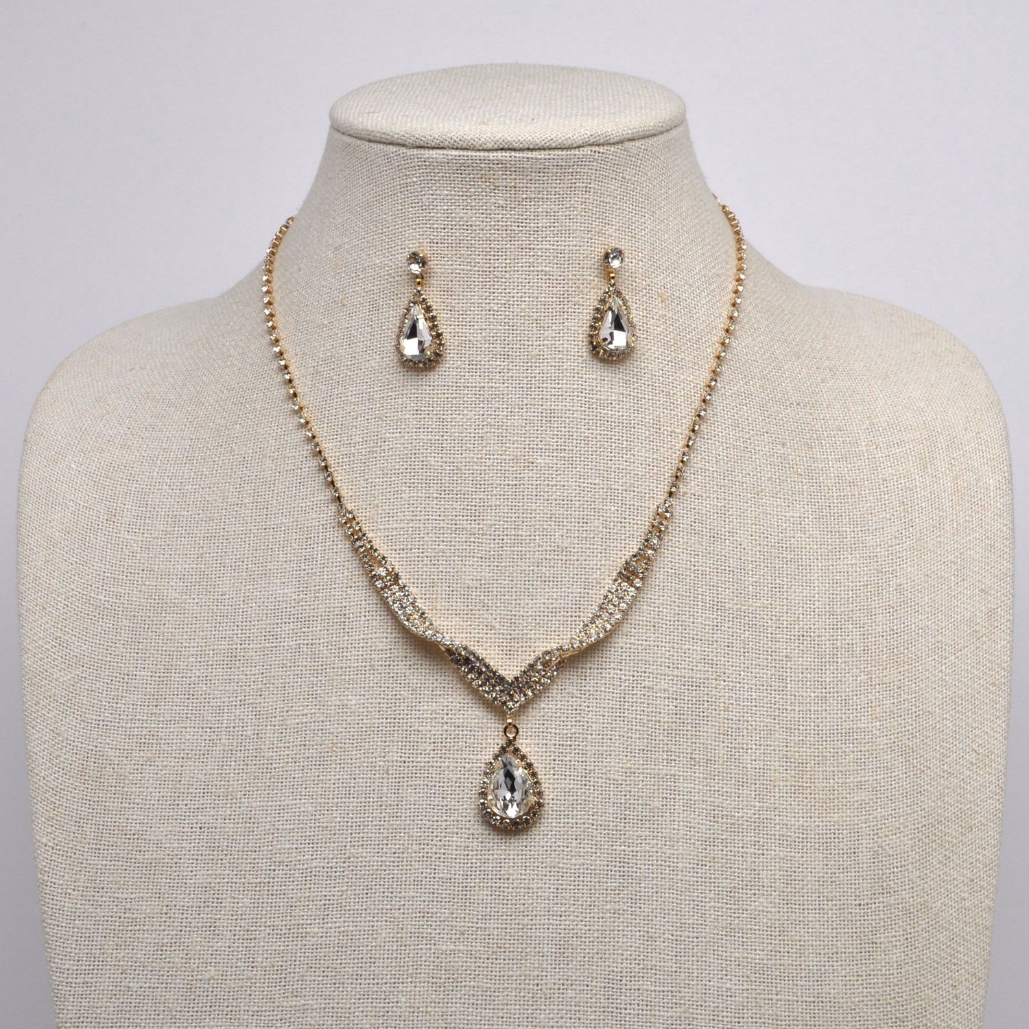 J15494S1G CLR/G TWISTED TRDRP STONE SET