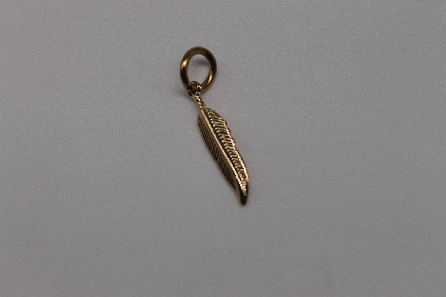 Gold Light as a Feather Charm