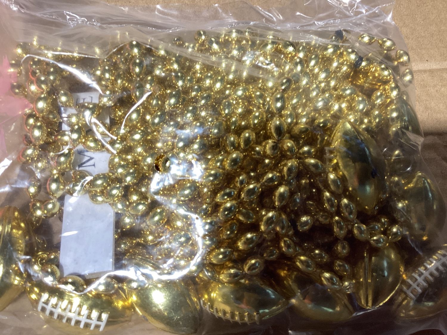 33&quot; 6 x 9mm Oval Gold Bead with Football Pendant (Dozen)