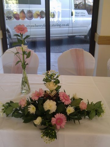 Top Table Arrangement And Single Flower Vase