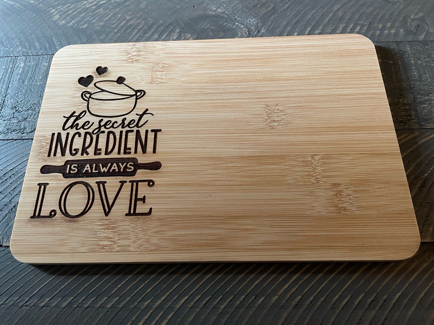 The Secret Ingredient Is Always Love 9.8 x 6.68 Inch Bamboo Cutting Board