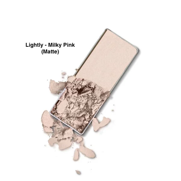 Merle Norman Soft Touch Eye Shadow in the Lightly - Milky Pink Matte shade on a white background with case slightly opened. 