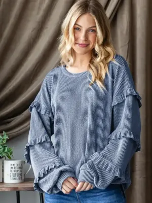The Puff Sleeve Solid Urban Ribbed Top With Shirring in Denim Vintage is being worn by a beautiful blonde woman. 