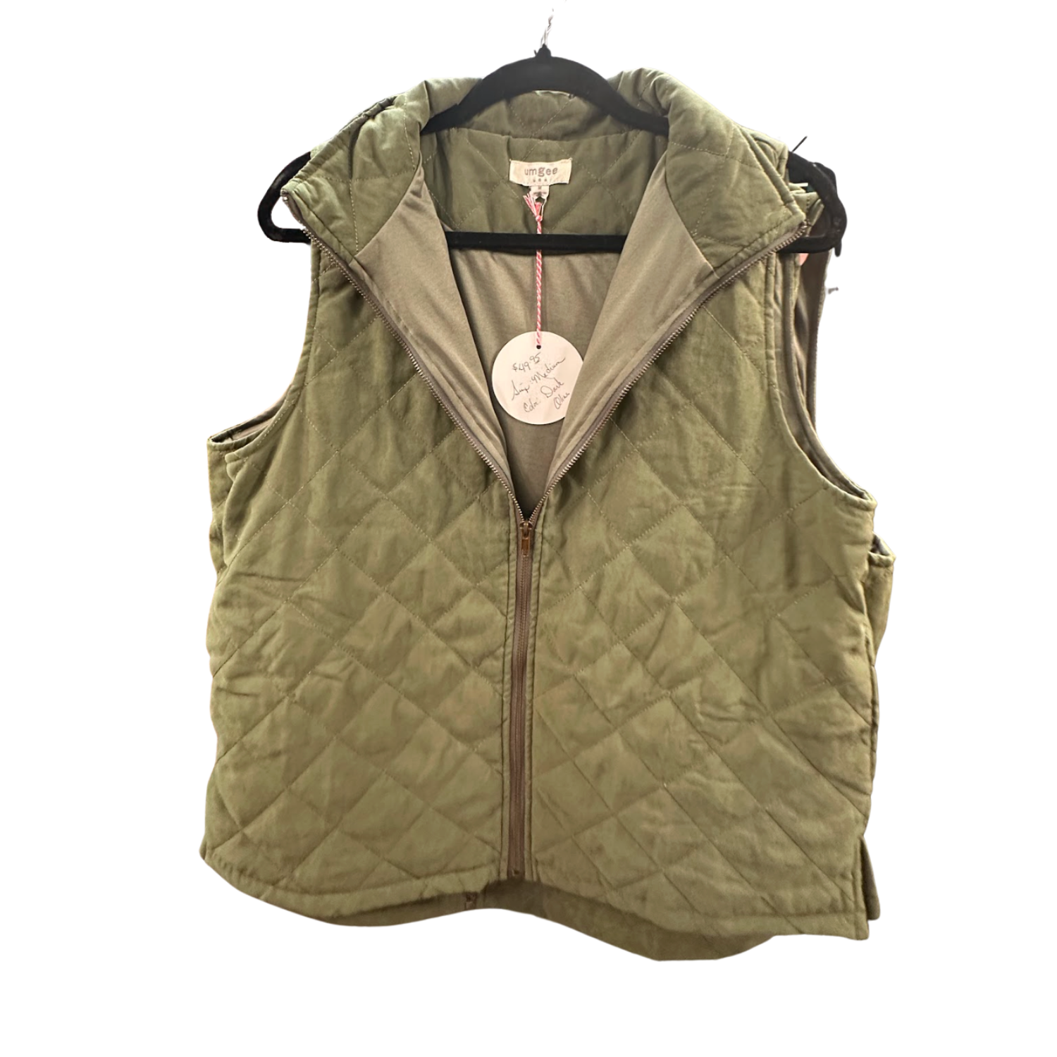 Umgee Ladies Full-Zip Quilted Vest hanging on a rack in Merle Norman, Elizabethton | GiGi's Boutique.