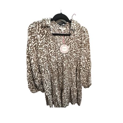 UMGEE Castell Ladies Flowy Top over a white background showing its unique color and fabric design. 