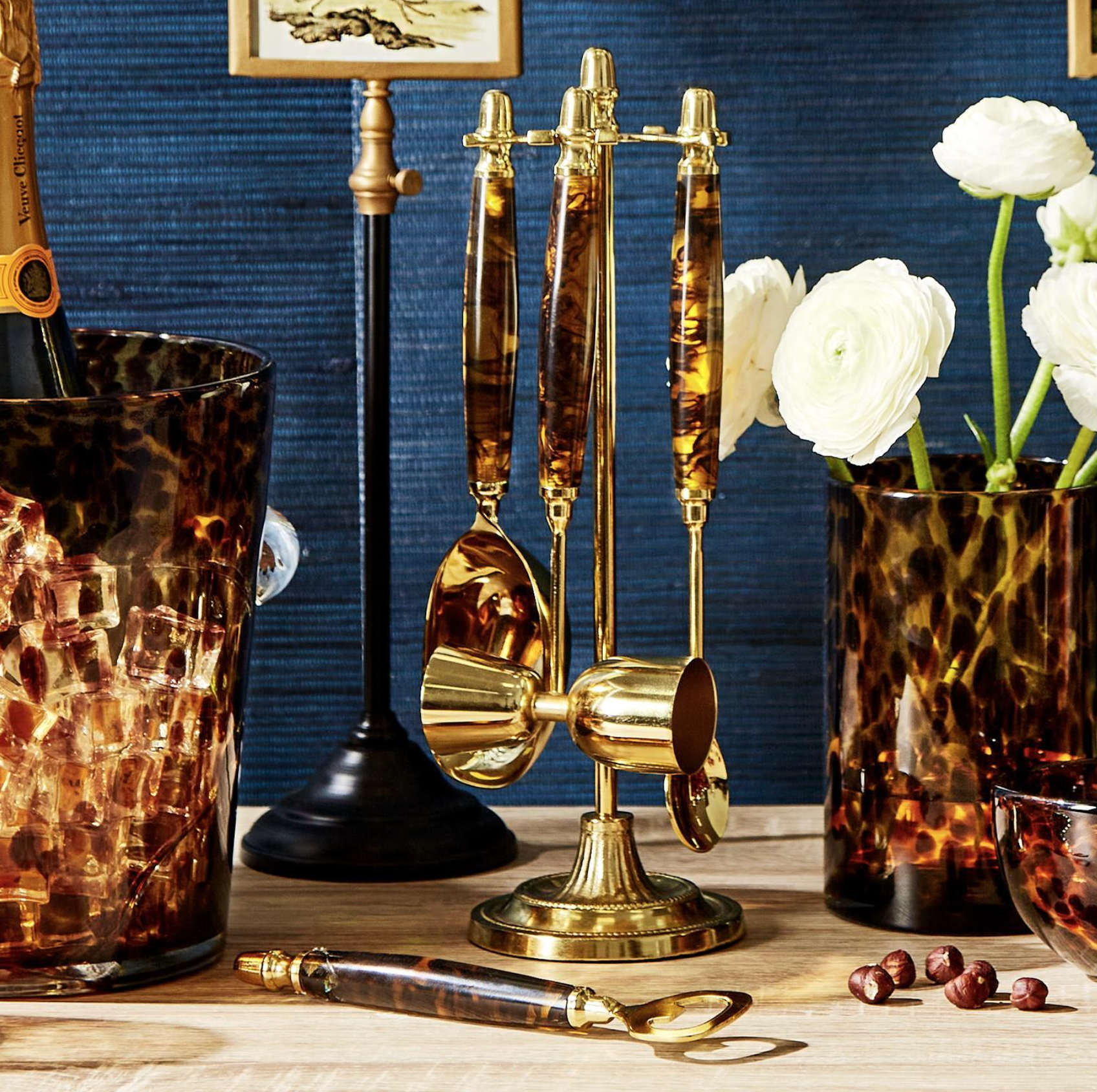 Two's Company 4 Pc Tortoise Print Bar Set with Stand sitting on a counter at Merle Norman Elizabethton. 