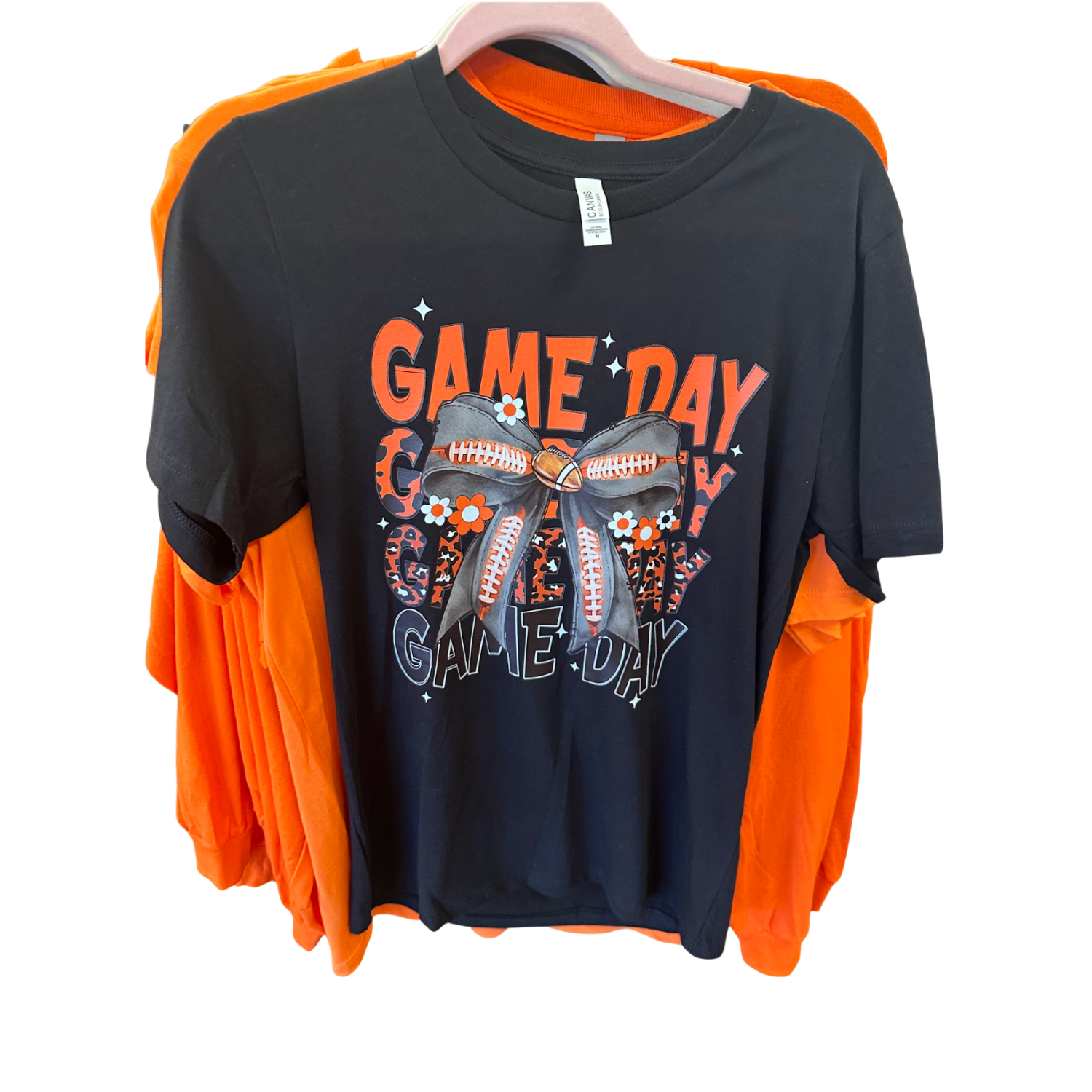 The Black Ladies' UT Vols Game Day T-shirt is hanging on a rack at Merle Norman Elizabethton. 