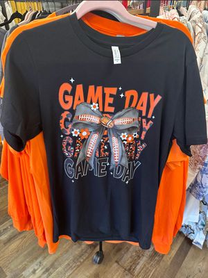 The Black Ladies' UT Vols Game Day T-shirt is hanging on a rack at Merle Norman Elizabethton. 