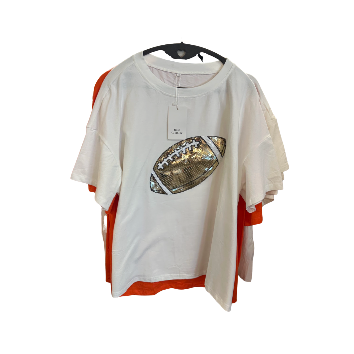 Rosa Clothing Football  T-shirt in White & Shimmering gold hanging on a rack in Merle Norman Elizabethton. 