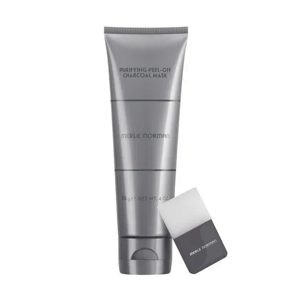 Purifying Peel-Off Charcoal Mask Merle Norman Purifying Peel-Off Charcoal Mask bottle and brush on a white background - product iamge.